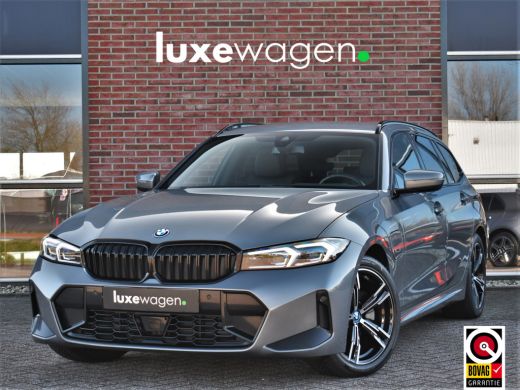 BMW 3 Serie Touring 320e M-Sport ACC HUD Sfeer Camera HiFi Stuurverw BMW 3 Serie Touring 320e M-Sport ACC HUD Sfeer Camera HiFi Stuurverw