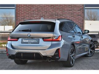 BMW 3 Serie Touring 320e M-Sport ACC HUD Sfeer Camera HiFi Stuurverw