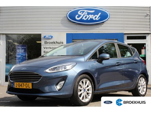Ford Fiesta Ford 1.0EB TITANIUM | NL-AUTO! | 1e EIGENAAR! | WINTERPACK: STOEL, STUUR & VOORRUITVERWARMING | N... Ford Fiesta Ford 1.0EB TITANIUM | NL-AUTO! | 1e EIGENAAR! | WINTERPACK: STOEL, STUUR & VOORRUITVERWARMING | N...