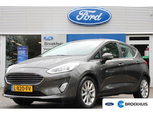 Ford Fiesta 1.0EB TITANIUM | NL-AUTO! | DEALER OH! | WINTERPACK | CRUISE CONTROL | LED | PARKEER SENSOREN 16"... Ford Fiesta 1.0EB TITANIUM | NL-AUTO! | DEALER OH! | WINTERPACK | CRUISE CONTROL | LED | PARKEER SENSOREN 16"...