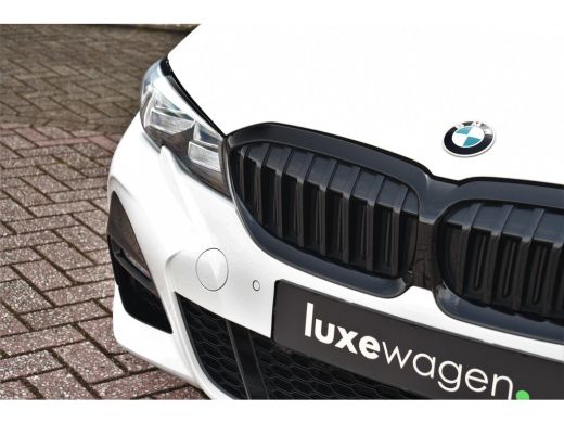 BMW 3 Serie Touring 330e M-Sport Pano Trekhaak Harman/K 19inch Camera ActivLease financial lease