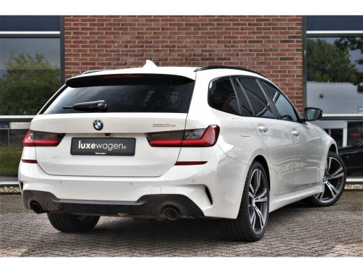 BMW 3 Serie Touring 330e M-Sport Pano Trekhaak Harman/K 19inch Camera ActivLease financial lease