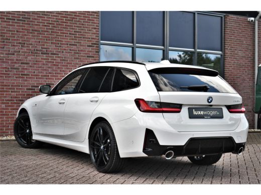 BMW 3 Serie Touring 330e M-Sport Pano ACC El-zetel HUD 19inch Camera Adp-onderstel ActivLease financial lease