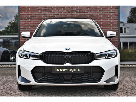 BMW 3 Serie Touring 330e M-Sport Pano ACC El-zetel HUD 19inch Camera Adp-onderstel ActivLease financial lease