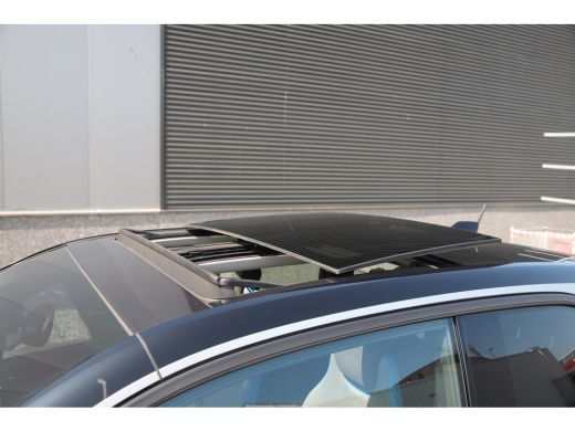 BMW i3 Executive 120Ah 42 kWh/Sunroof/Adaptive/Camera/W-pomp/20"/3-fase ActivLease financial lease
