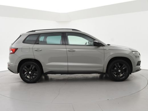 Skoda Karoq 1.5 TSI ACT 150 PK DSG AUT. SPORTLINE STEEL GREY + VIRTUAL COCKPIT | TREKHAAK | CAMERA | ADAPTIVE... ActivLease financial lease