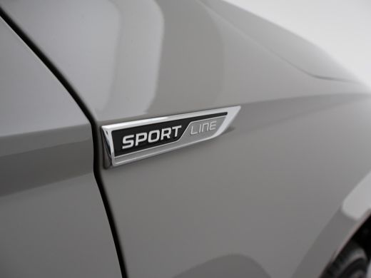 Skoda Karoq 1.5 TSI ACT 150 PK DSG AUT. SPORTLINE STEEL GREY + VIRTUAL COCKPIT | TREKHAAK | CAMERA | ADAPTIVE... ActivLease financial lease