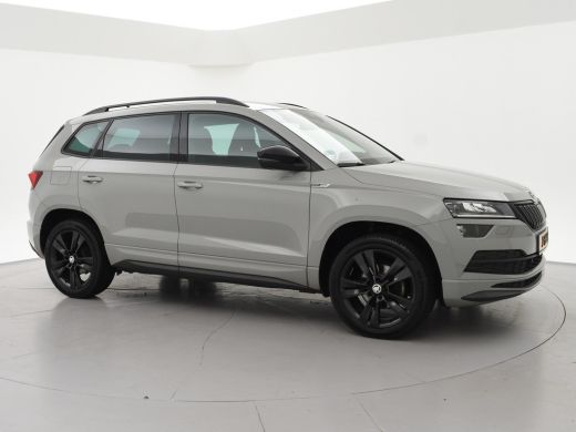 Skoda Karoq 1.5 TSI ACT 150 PK DSG AUT. SPORTLINE STEEL GREY + VIRTUAL COCKPIT | TREKHAAK | CAMERA | ADAPTIVE... ActivLease financial lease