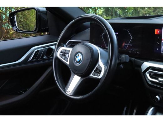 BMW i4 eDrive40 High Executive 84 kWh M-Sport Sanremo Grün | HUD | Camera | Carplay | Trekhaak | Elektri... ActivLease financial lease