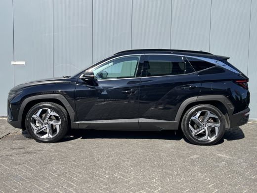 Hyundai Tucson 1.6 T-GDI 265pk PHEV Premium Sky 4WD | Leder | Schuif kanteldak | Keyless | Navigatie | Elektrisc... ActivLease financial lease