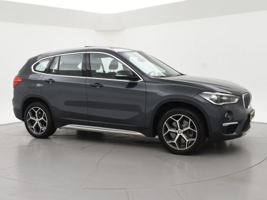 BMW X1 sDrive20i 192 PK AUT. + TREKHAAK | PANORAMA | SPORTSTOELEN LEDER | HEAD-UP | CAMERA | STOELVERWAR... ActivLease financial lease