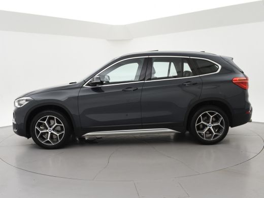 BMW X1 sDrive20i 192 PK AUT. + TREKHAAK | PANORAMA | SPORTSTOELEN LEDER | HEAD-UP | CAMERA | STOELVERWAR... ActivLease financial lease
