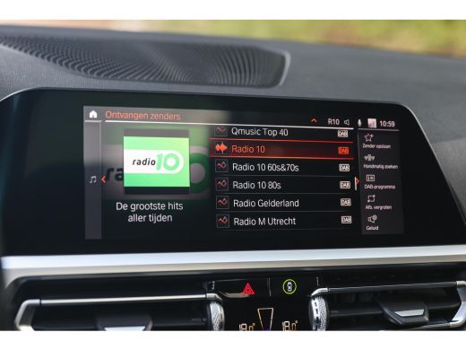 BMW 3 Serie 320i High Executive M Sport Automaat / Schuif-Kanteldak / Sportstoelen / Achteruitrijcamera / M A... ActivLease financial lease