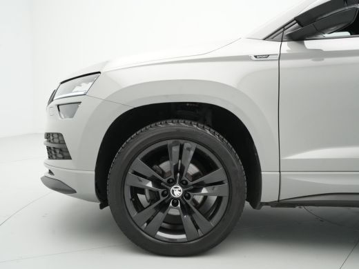 Skoda Karoq 1.5 TSI ACT 150pk DSG Sportline Business Navigatie CantonSound Stoelverwarming Camera Carplay Sid... ActivLease financial lease