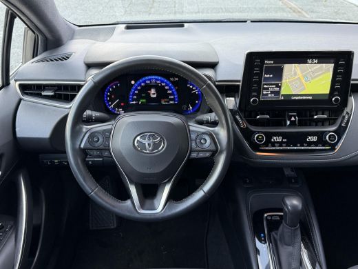 Toyota Corolla Touring Sports 1.8 Hybrid Style **NAVIGATIE/ HEAD-UP DISPLAY/ STOELVERWARMING/ 36 MAANDEN GARANTIE** ActivLease financial lease