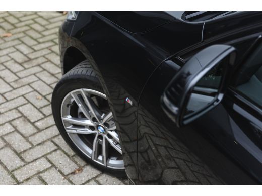 BMW 1 Serie 118i High Executive M Sport Automaat / Panoramadak / Achteruitrijcamera / Comfort Access / Adapti... ActivLease financial lease