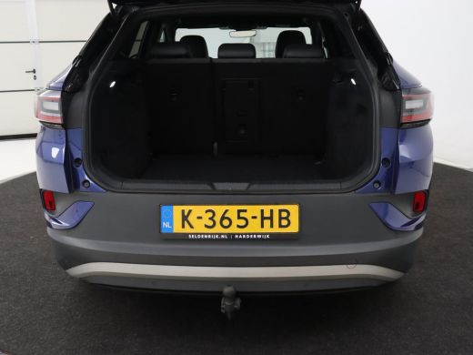 Volkswagen ID.4 First 77 kWh | Trekhaak | Stoel & stuurverwarming | Adaptive cruise | Camera | Carplay | Half led... ActivLease financial lease