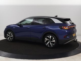 Volkswagen ID.4 First 77 kWh | Trekhaak | Stoel & stuurverwarming | Adaptive cruise | Camera | Carplay | Half led...