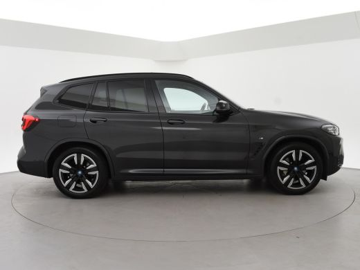 BMW iX3 80 kWh FACELIFT M-SPORT SOH 98,8% + TREKHAAK | SPORTSTOELEN LEDER | PANORAMA | ADAPTIVE CRUISE | ... ActivLease financial lease