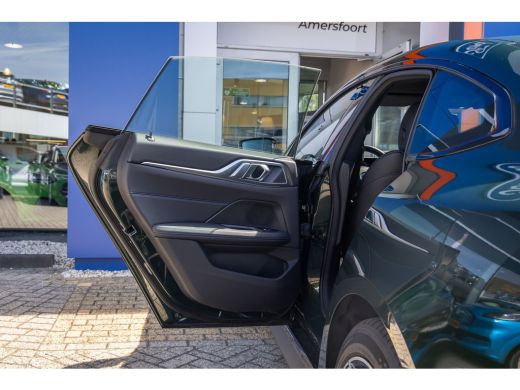 BMW i4 eDrive35 High Executive 70 kWh | M-sport | Cruise adaptief | Camera | Elektrisch bedienbare achte... ActivLease financial lease