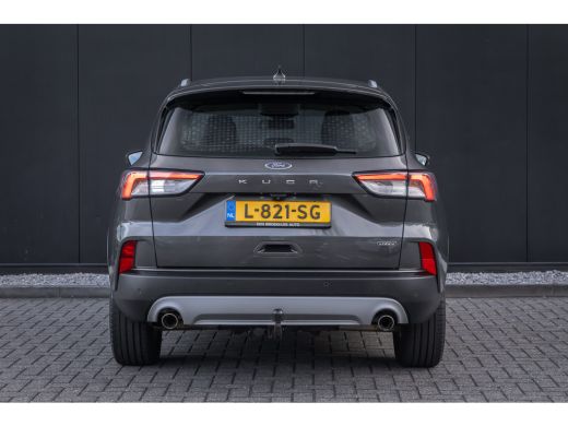Ford Kuga 2.5 PHEV Titanium | 100% dealer o.h. | Trekhaak | Adaptieve cruise | Standkachel | Parkeercamera ... ActivLease financial lease