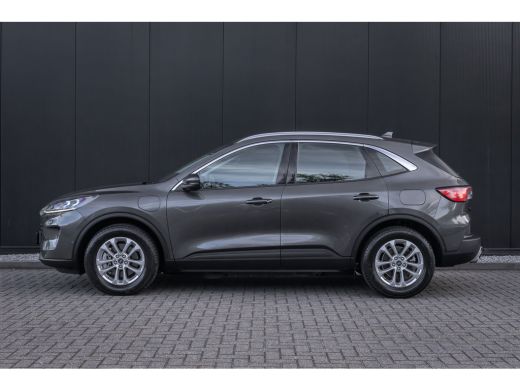 Ford Kuga 2.5 PHEV Titanium | 100% dealer o.h. | Trekhaak | Adaptieve cruise | Standkachel | Parkeercamera ... ActivLease financial lease