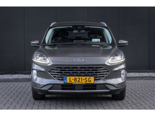 Ford Kuga 2.5 PHEV Titanium | 100% dealer o.h. | Trekhaak | Adaptieve cruise | Standkachel | Parkeercamera ... ActivLease financial lease