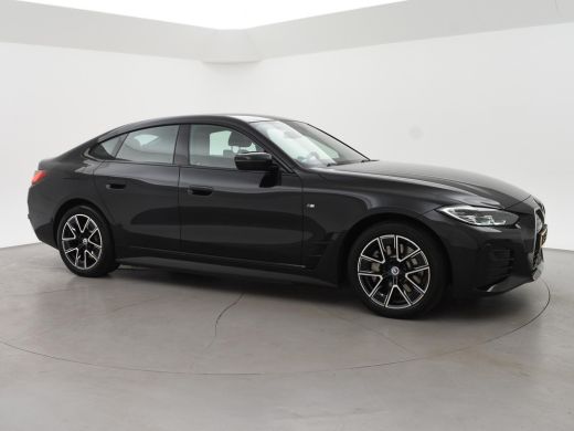 BMW i4 eDrive40 84 kWh M-SPORT + ADAPTIVE CRUISE | SFEERVERLICHTING | LEDER SPORTINTERIEUR ActivLease financial lease